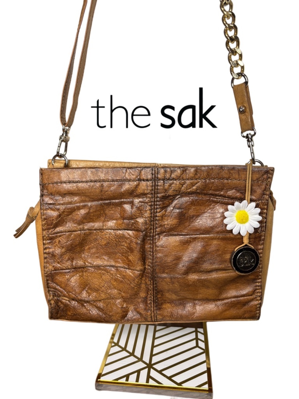 THE SAK distressed brown leather crossbody bag with daisy charm